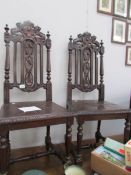 A pair of Gothic style hall chairs