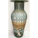 A Dennis China Works vase decorated with a forest scene featuring owls and hares, 36cm tall,