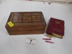 A Victorian cribbage board/box complete with counters and cards