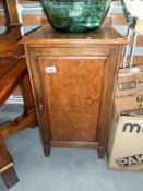 A walnut pot cupboard