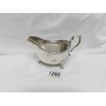 A silver milk jug, Birmingham 1932/33, 5.