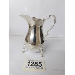 A silver cream jug,