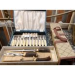 A cased set of fish knives and forkss,