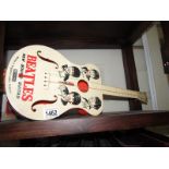 A toy Beatles guitar, a/f