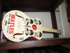 A toy Beatles guitar, a/f