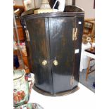 A small oak barrel front corner cupboard