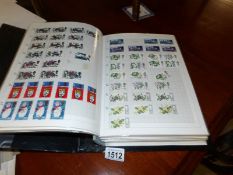 A large album collection of GB stamps, mint, used, high values, pairs,