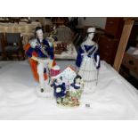 A pair of Staffordshire figures,