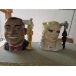 2 Royal Doulton celebrity collection character jugs being Louis Armstrong and Mae West