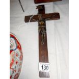 An oak crucifix with metal figure of Christ