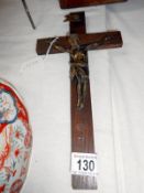 An oak crucifix with metal figure of Christ