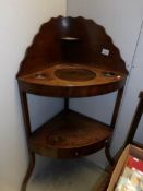 A mahogany corner washstand