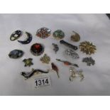 A mixed lot of costume brooches