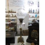 A Corinthian column oil lamp with glass font and later shade