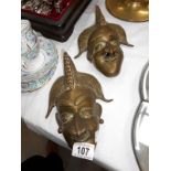 2 brass wall masks