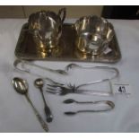 A silver plated tray, sugar bowl cream jug,