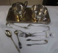 A silver plated tray, sugar bowl cream jug,