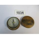 An old compass in wooden case