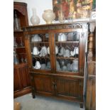 An oak lead glazed book case