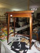 An Edwardian inlaid fold over card table