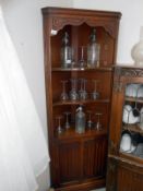 An oak corner cabinet