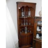 An oak corner cabinet