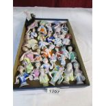A good collection of porcelain pin cushion dolls
