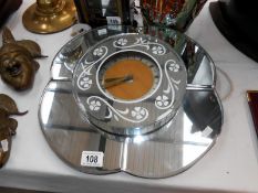 A mirrored wall clock