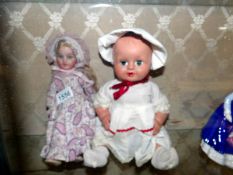 A Porcelain headed doll and one other