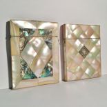 A mother of pearl card case with central emblem together with a mother of pearl and abalone card