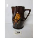 A Royal Doulton series ware motto jug inscribed 'It is hard for an empty bag to stand upright'