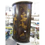 An oriental hand decorated corner cupboard