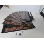 A collection of 85 penny red stamps