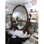 A mahogany toilet mirror with marble base