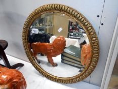 A gilt framed mirror