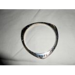 A silver bracelet inscribed Hope,