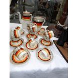 A 1950's 27 piece retro oriental ivory bistro rainbow ware coffee set,