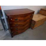 A mahogany bow front 4 drawer chest on splay feet