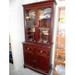 A mahogany display cabinet