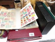 3 albums of stamps and a German bible