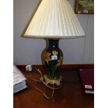 A table lamp decorated with daffodils