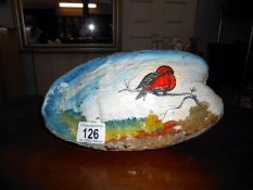 A vintage hand painted coconut shell