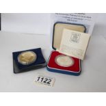 A mint cased 1977 silver jubilee coin and a mint Elizabeth II 2007 Cook Islands one dollar