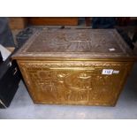 A brass log bin