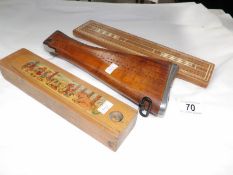 A crib board in the form of a rifle stock,