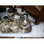 A 4 piece silver plated tea set including tray and 2 other items of tea ware