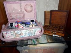 A sewing basket with contents and 2 wood cased games