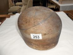 A wooden milliner's hat mould