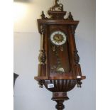 A mahogany wall clock