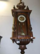 A mahogany wall clock